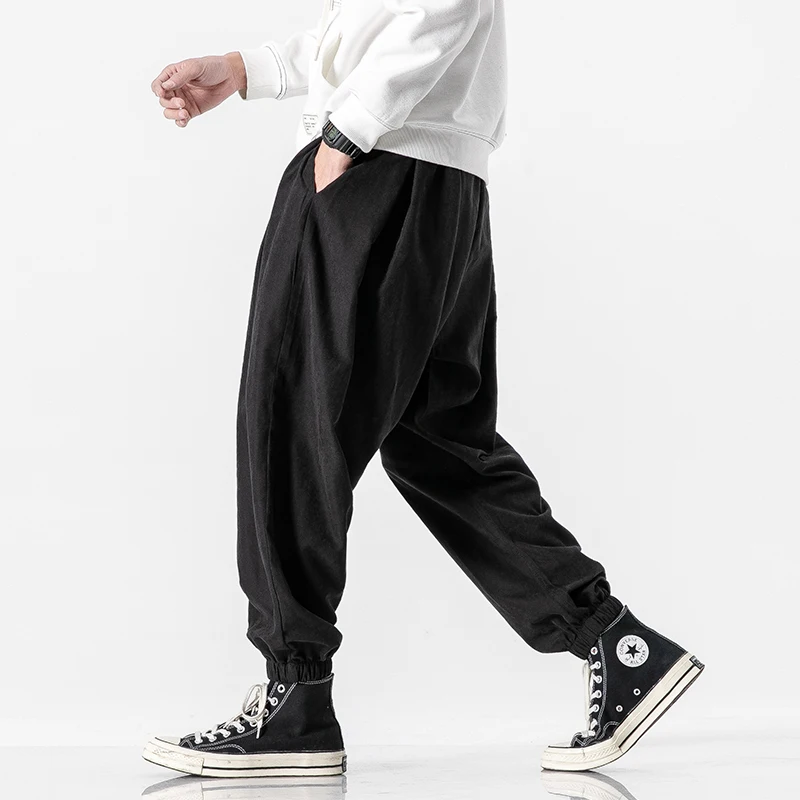 Pantalones negros para hombre, ropa de calle de Hip Hop, pantalones Harem de moda, pantalones de chándal informales, talla grande 5XL