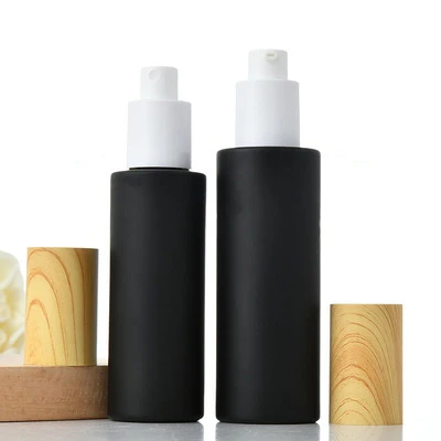 

Frosted Matt Black Glass Eye Cream Cosmetic Container Spray Lotion Bottle Jars Refillable Bottle With Wood Grain Cover 20ml 60ml