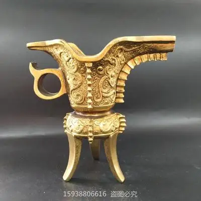 

Antique Brass gilt phoenix pattern three legged Jue cup home decoration ornaments