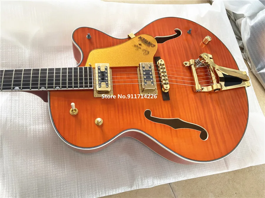 High quality custom version of jazz double F hole orange electric guitar gold large rocker vibrato