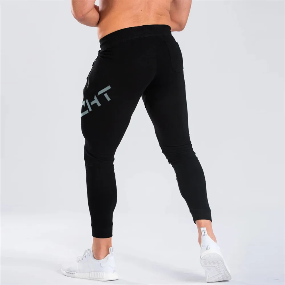 Pantalones de chándal ajustados para hombre, ropa deportiva de algodón, color negro, informal, para gimnasio, otoño