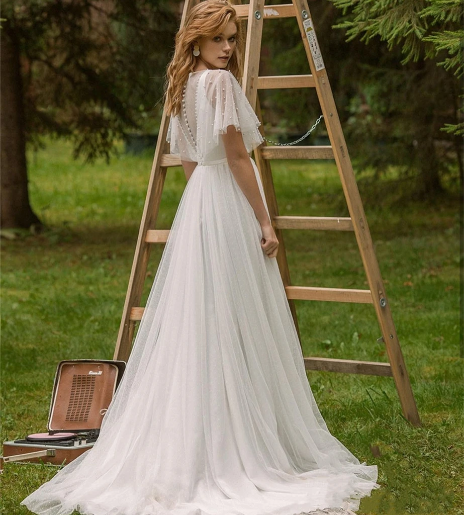 Abito da sposa bohémien a pois A-Line O-Collo Manica corta Perline di pizzo Perle Bottoni Lunghezza pavimento Abito da sposa con strascico Personalizzato