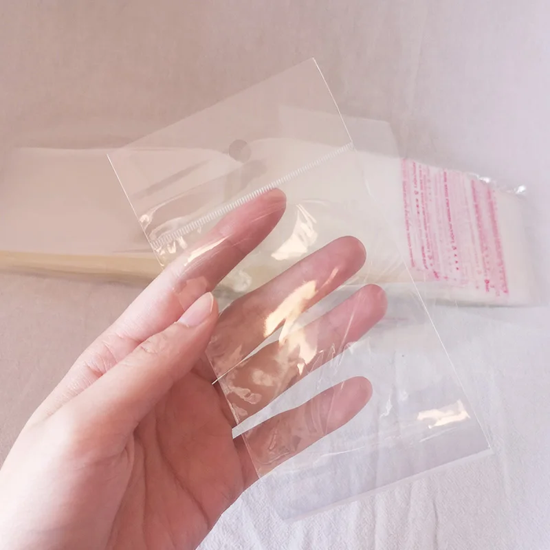 100pcs Long self adhesive seal clear plastic hair packaging bags hair extensions plastic packaging bag with header bag