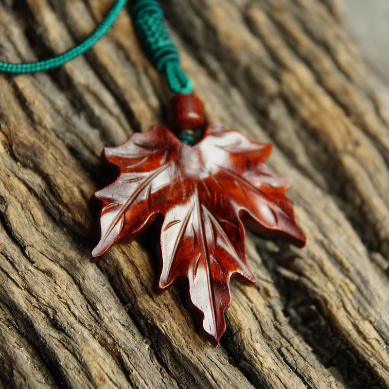 Hand-Carved Red Maple Leaf Feng Shui Pendant - Exquisite Wooden Sculpture with Hanging Strap, Perfect for Elegant Home Decor