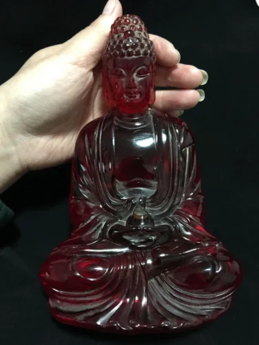 

Superb collection of beautiful red amber carvings of Buddha statues of Sakyamuni