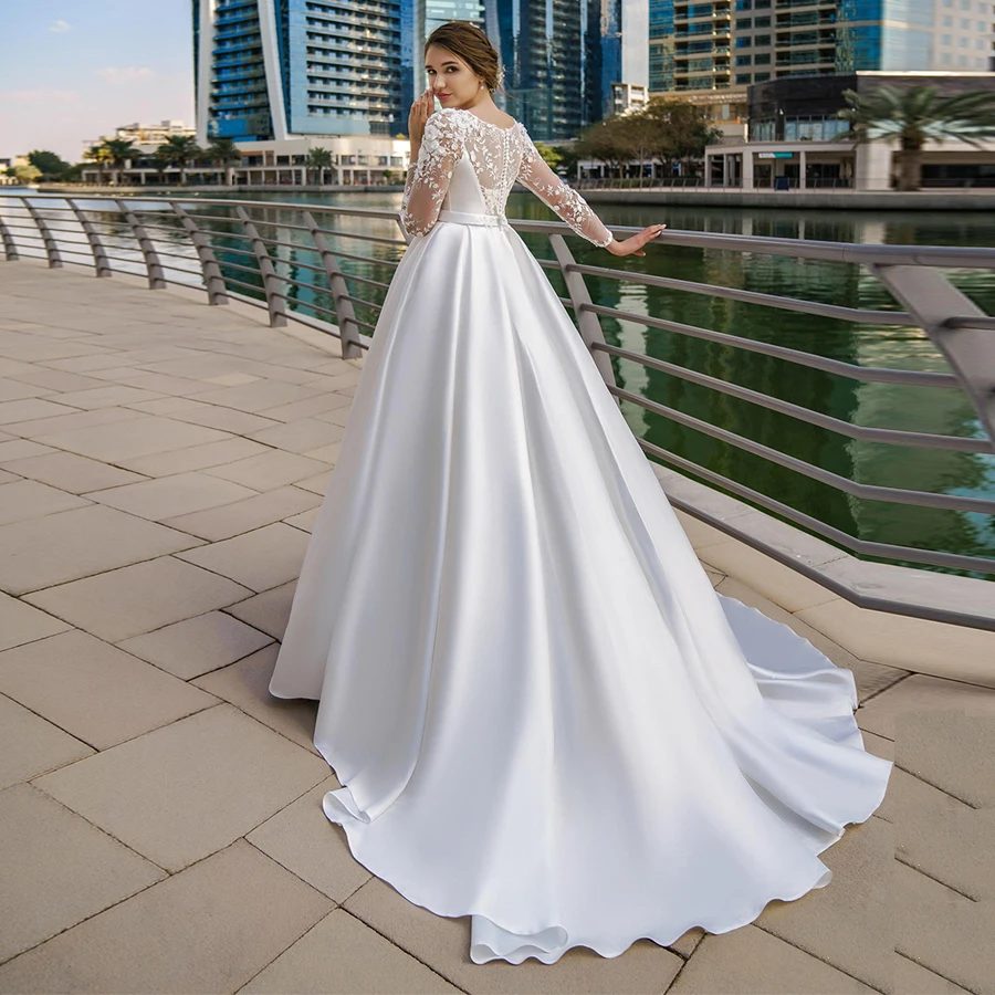 Elegante con abito da sposa musulmano in raso tascabile maniche lunghe scollo tondo Applique in pizzo abiti da sposa A-line Vestido De Novia