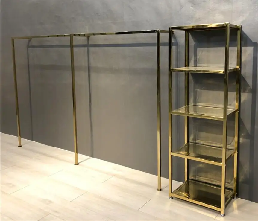 Titanium gold stainless steel display stand on the wall of clothing store