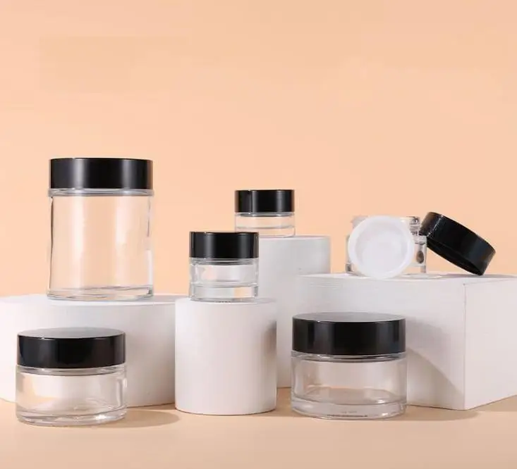 

Wholesale 5g 10g 15g 20g 30g 50g 100g Facial Cream Jars Empty glass jar Cosmetic Containers With Black Lid For Travel Packing SN