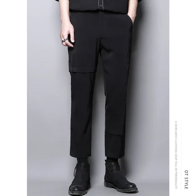 

Dark personality high-level design sense of asymmetric splicing false two casual pants nine-minute small pants men slim pants