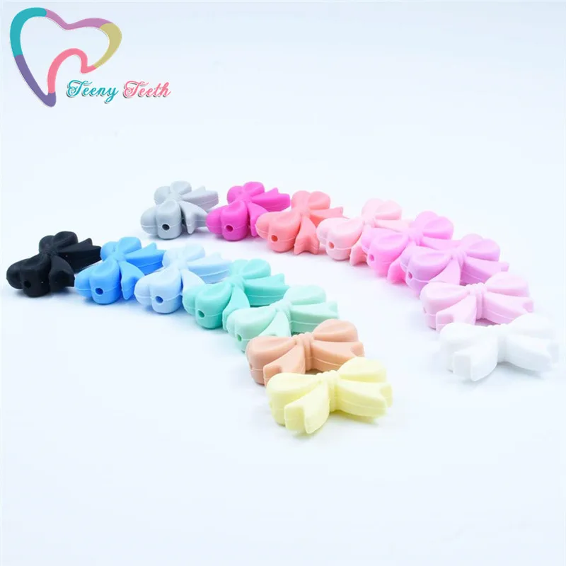 

200PCS Bow Tie Silicone Beads Baby Teethers Food Grade Silicone DIY Teething Necklace Jewelry Making Soother Chain Bowknot Beads