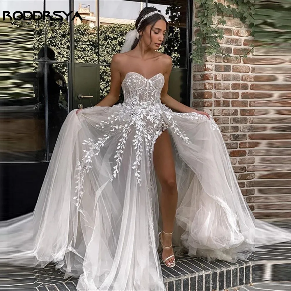 RODDRSYA Strand Brautkleider Für Braut Elegante Spitze Boho Brautkleider Trägerlos ÄrmellRoddrsya Strand Brautkleider für Braut elegante Spitze Boho Brautkleider träger lose ärmellose High Split Prinzessin Brautkleider