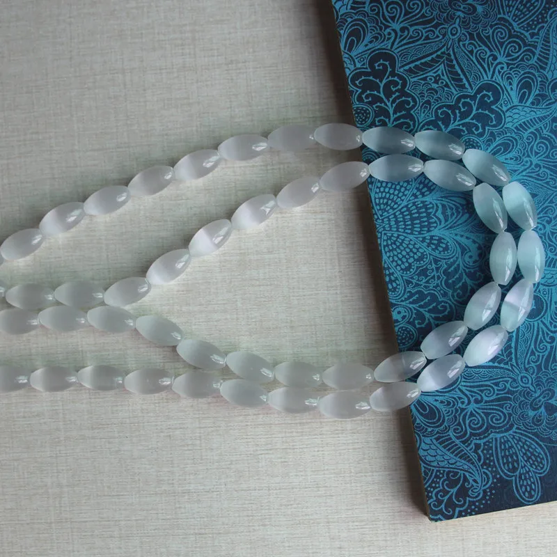 About 8x15mm rice shape cats eye glass beads,1.2mm in hole size,25 pieces per lot,factory price