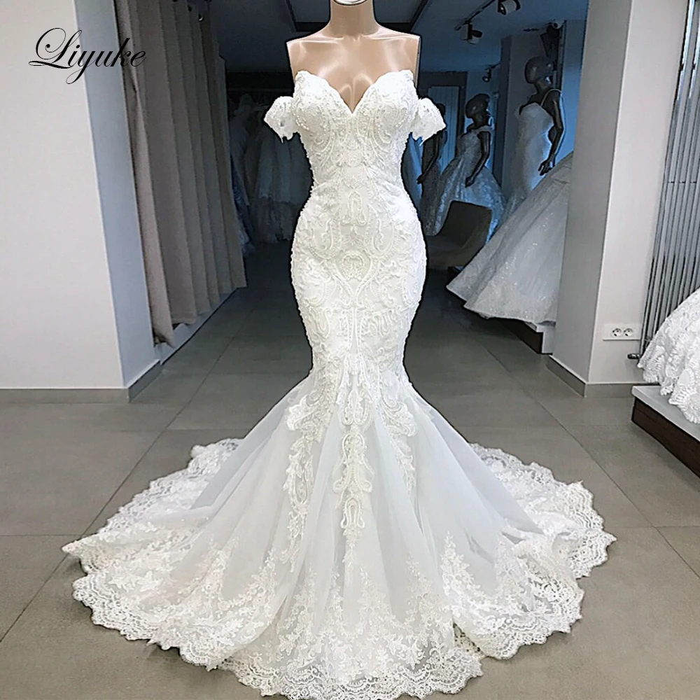 

Liyuke Mermaid Wedding Dress Luxury Beading Plears Off The Shoulder With Bling Sleeveless Bridal Gowns