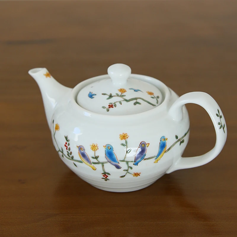 color painting of flowers and birds imported from Japan successful ceramic teapot with a built-in filter the teapot