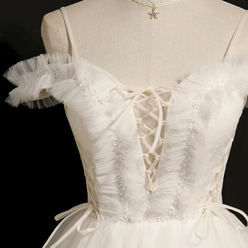 AnXin SH princesa encaje blanco correa de espagueti volantes lazo de cristal con cordones vestido de noche corto personalizado pequeño vestido blanco