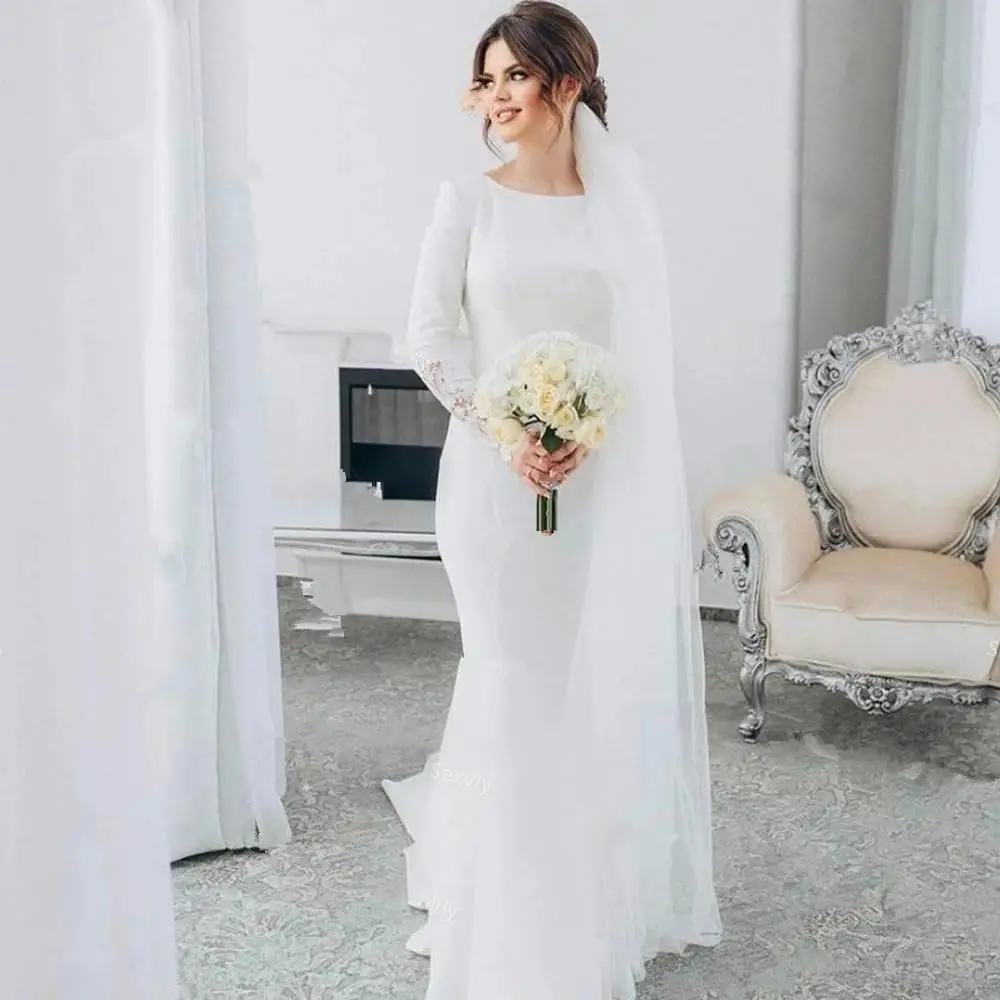 Wdzięku biała syrenka suknia ślubna z pełnym rękawem Sheer artystyczny Design koronka z tyłu Appliqued długie suknie ślubne Robe de Mariée