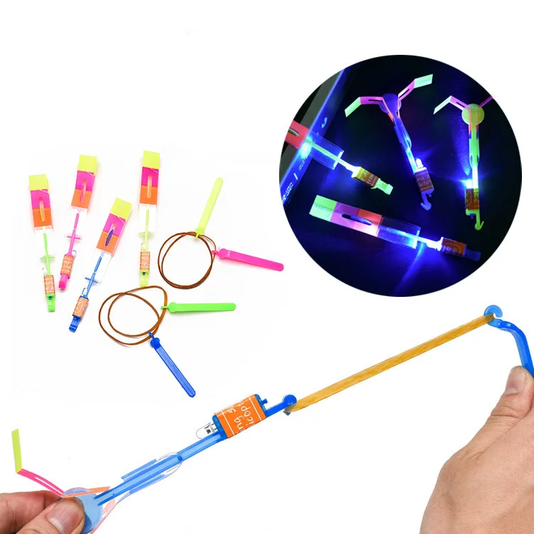 

10PCS Luminous Slingshot Toys Outdoor Shining Rocket Flash LED Light Night Kids Slingshot Elastic Helicopter Rotating Toy