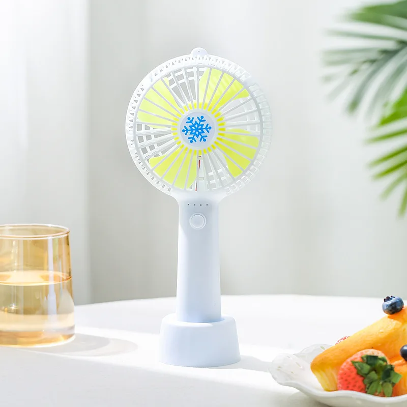 Mini handheld fan charging light with base desktop snowflake creative student usb small fan