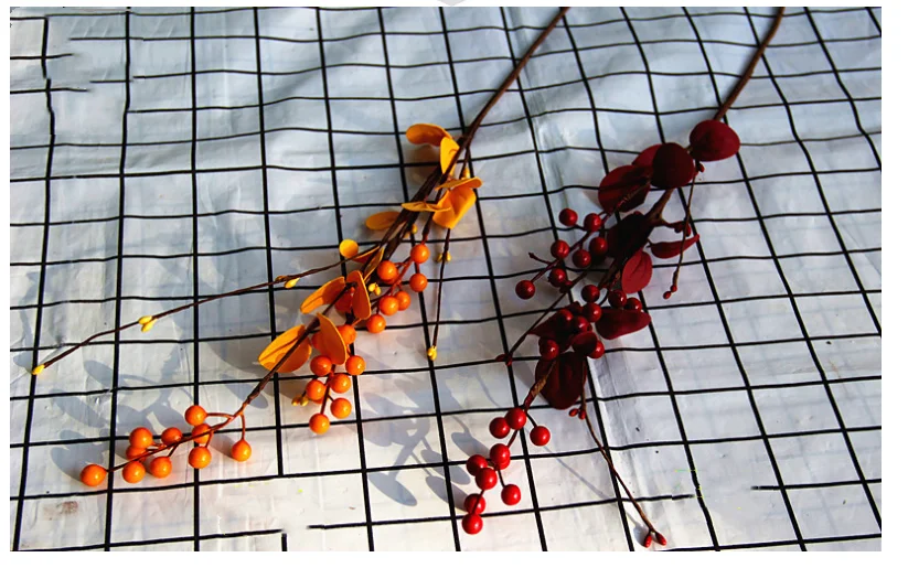 

Simulated red fruit with leaves Holly fortune fruit