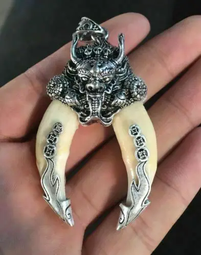 

Chinese-antique-dog-teeth-with-Tibetan-silver-amulet-carved-dragon-pendant