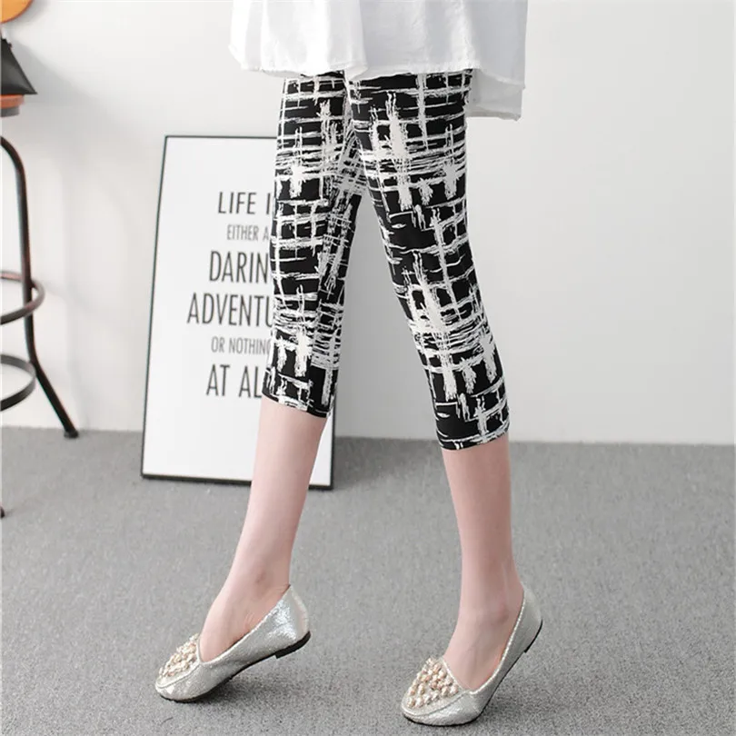 

YGYEEG Black And White Vertical Striped Printed Women Leggings Fashion Casual Elasticity Calf-Length Pants Female Fitnes Legging