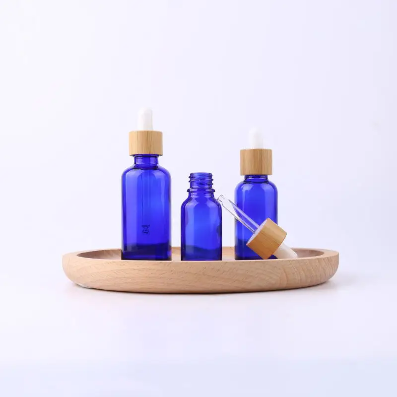 dropper bottle wholesale 5ml 10ml 15ml 30ml 50ml 100ml  essential oil bottles with bamboo lid different clours  bottle glass