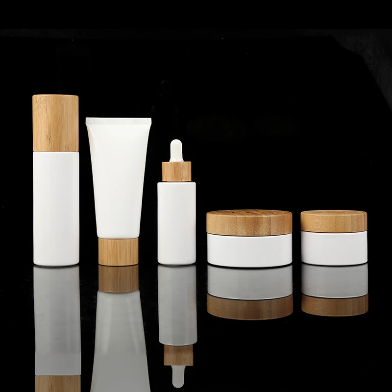 

Eco friendly 30g 50g 100g white PP plastic cosmetic cream jar with natural bamboo cap lid 30ml 50ml 100ml engraving logo