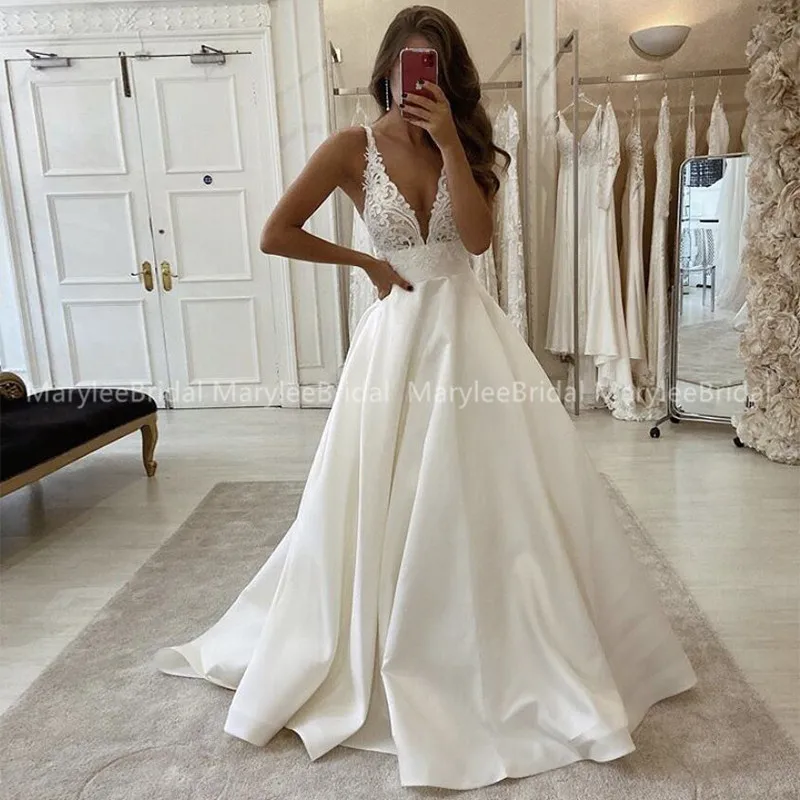 Robe de mariée plongeante à encolure en V avec bretelles fines, appliques en dentelle A-ligne, transparente, corsage, patients, quoi que ce soit avec poches, dos nu bas