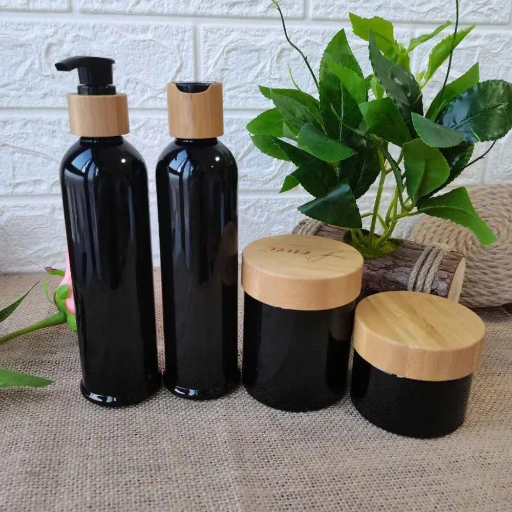 Custom logo 200ml Black PET plastic lotion bottle bamboo lid head shampoo/body wash bamboo pump lid Treatment Pump Serum Bottle