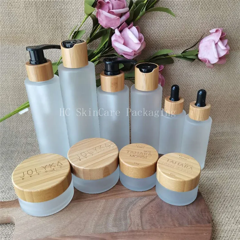 

Wholesale Round Shaped Glass Cream Jar with Bamboo Caps for Cosmetic Skin Care Lotion container Packaging