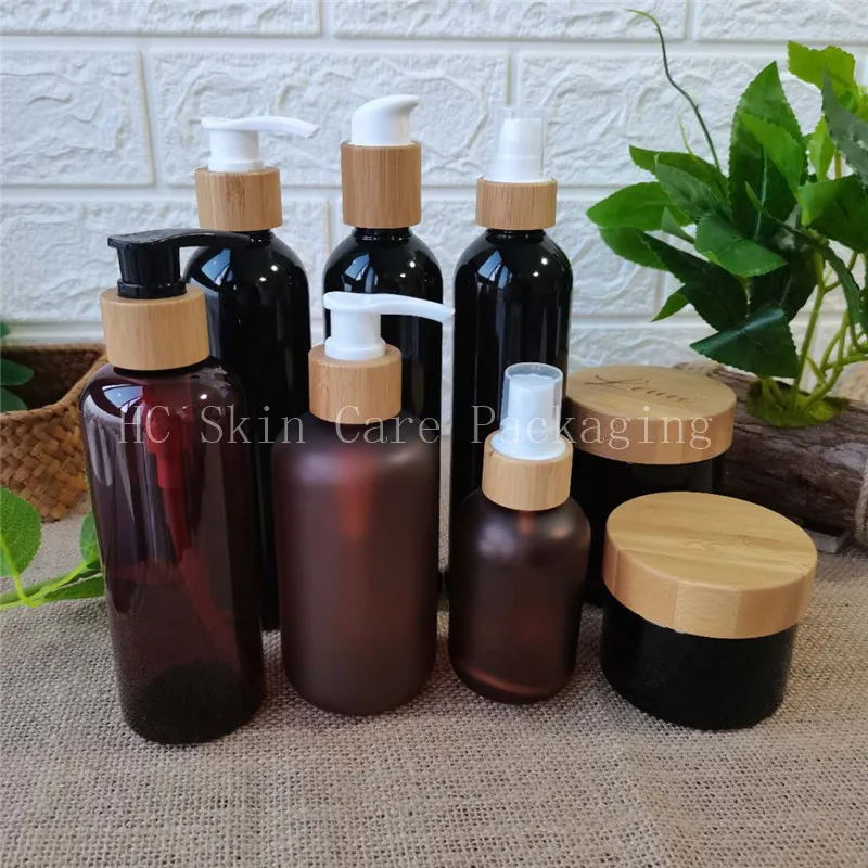 

Wholesale Amber/black frosted /white/clear plastic bottles and cream jars bamboo cap bottle cosmetic containers cream jar bulk