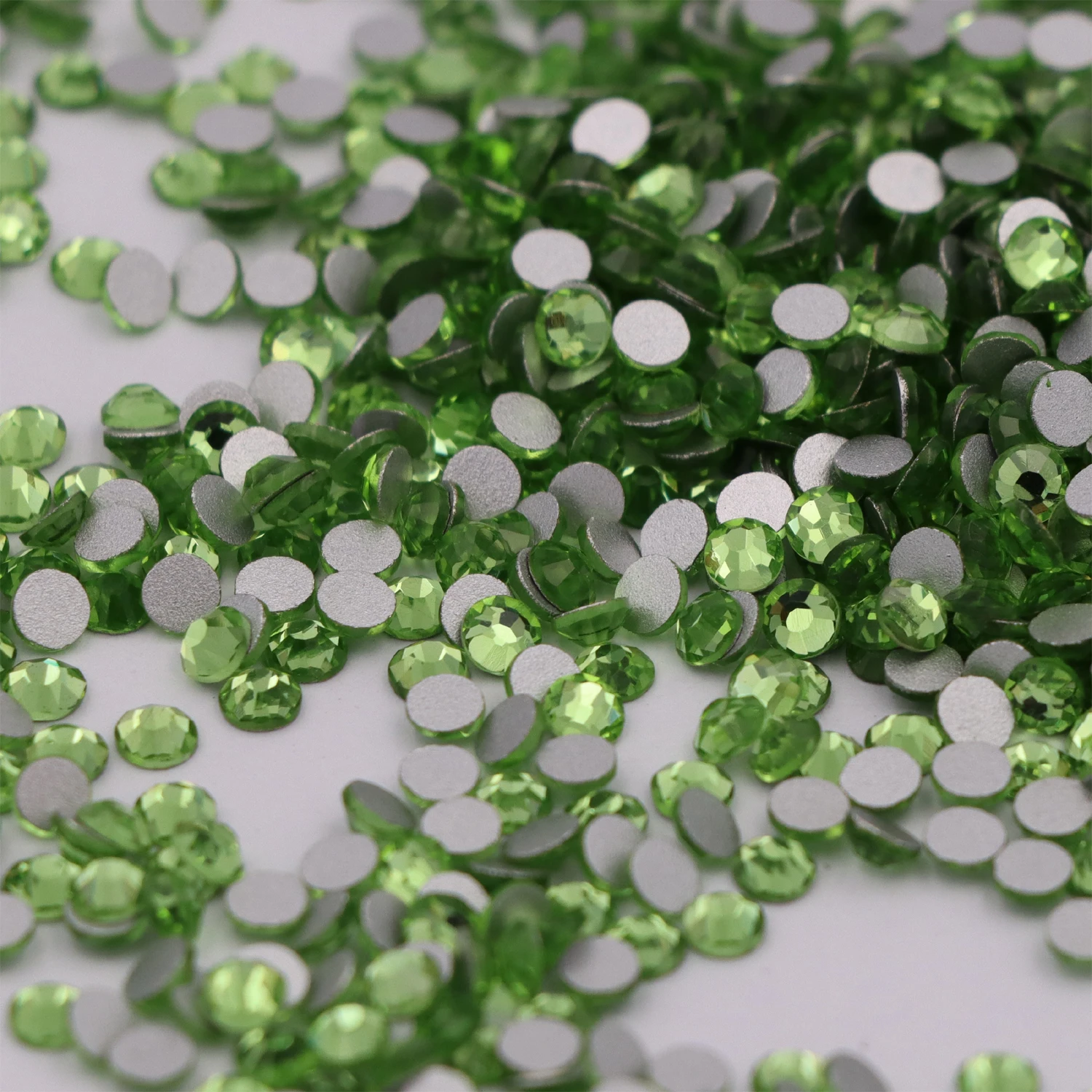 

High Quality SS3-SS34 Peridot Flat Back Nail Art Glue On Rhinestones / Non Hotfix Light Green Crystals