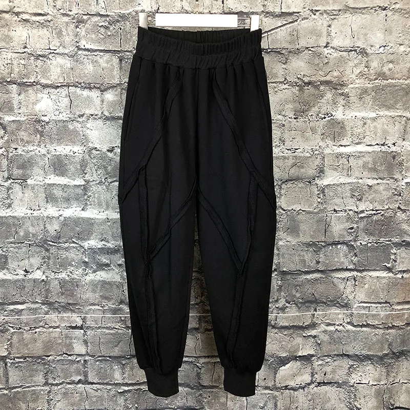 

Autumn and winter original design men's black slim feet pants personality stitching loose radish pants beam pants tide