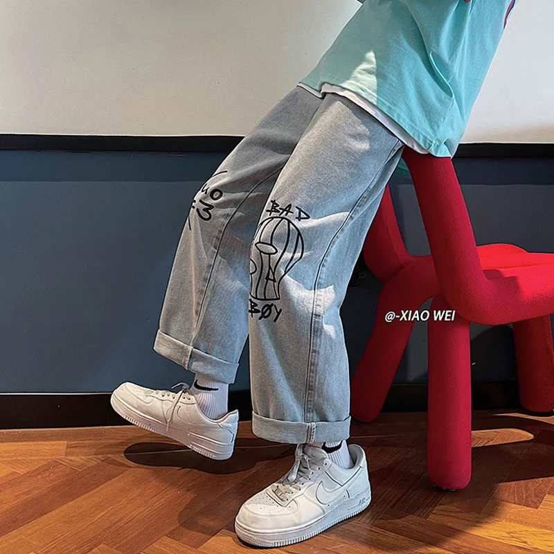 

Cartoon graffiti pants men's summer thin style ins loose straight jeans Korean fashion ruffian handsome hip hop masculina