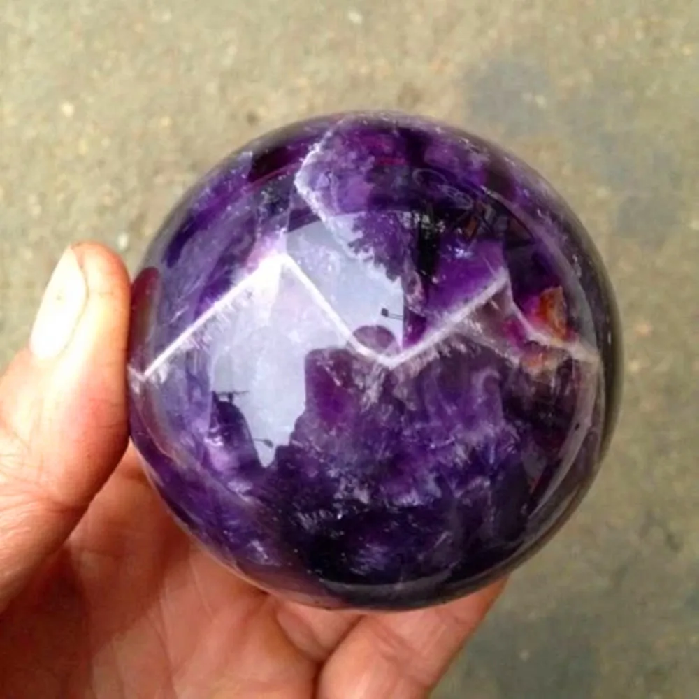 Natural energy amethyst Reiki ornament ball with impurity at the bottom of the raw stone mineral ball furniture. The ornament