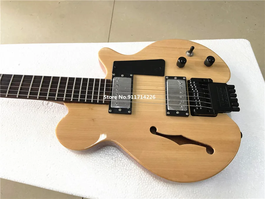 High-quality custom version of F hole headless electric guitar spruce panel double roll can be customized free shipping