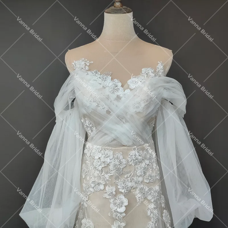 Spalle scoperte abito da sposa con applicazioni floreali 3D Criss Cross Tulle su misura una linea trasparente maniche lunghe A sbuffo abiti da sposa