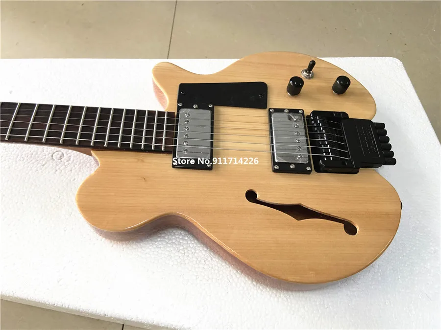 High-quality custom version of F hole headless electric guitar spruce panel double roll can be customized free shipping