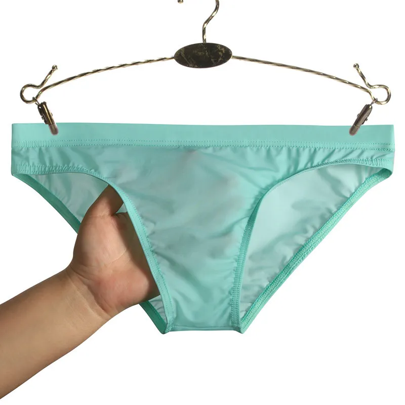 Sexy sexy cintura baixa gelo seda translúcido biquíni magro respirável cuecas masculinas tanga sexy cintura baixa transparente 2021 sem costura