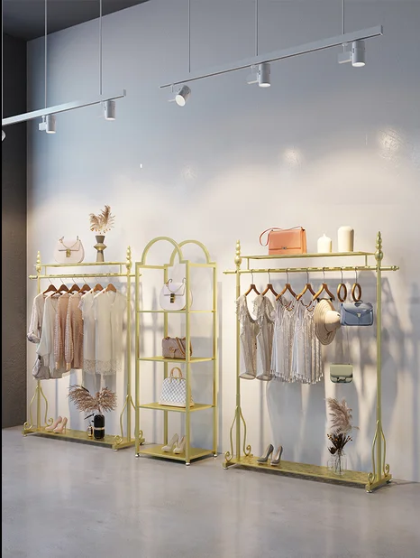 

Floor shelf of Tieyi women's clothing store display rack of golden clothing store floor creative hanger