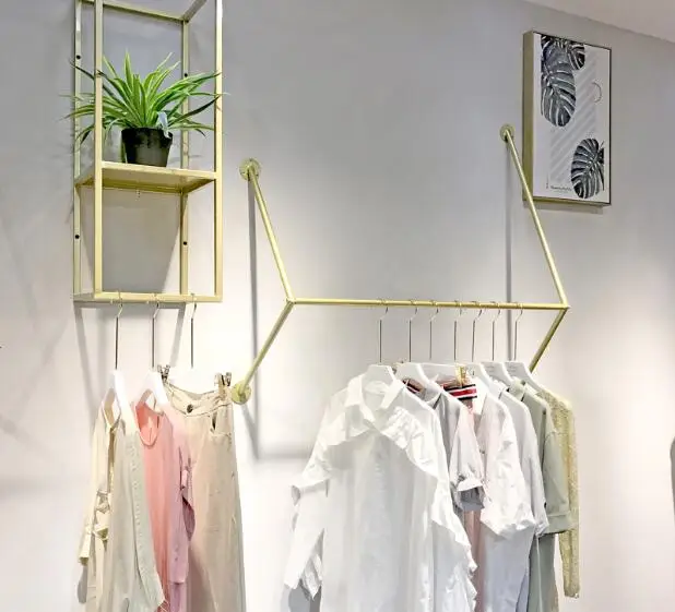 Clothes store display shelves hanging on the wall