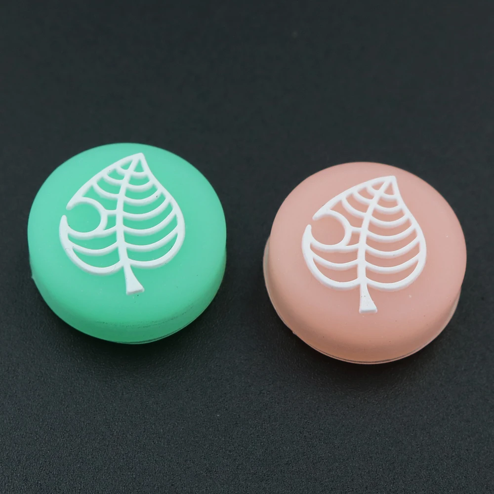 Joystick de silicona con forma de hoja luminosa para cruce de animales, tapas de agarre para pulgar de oso y hoja de árbol para controlador Nintendo Switch Lite