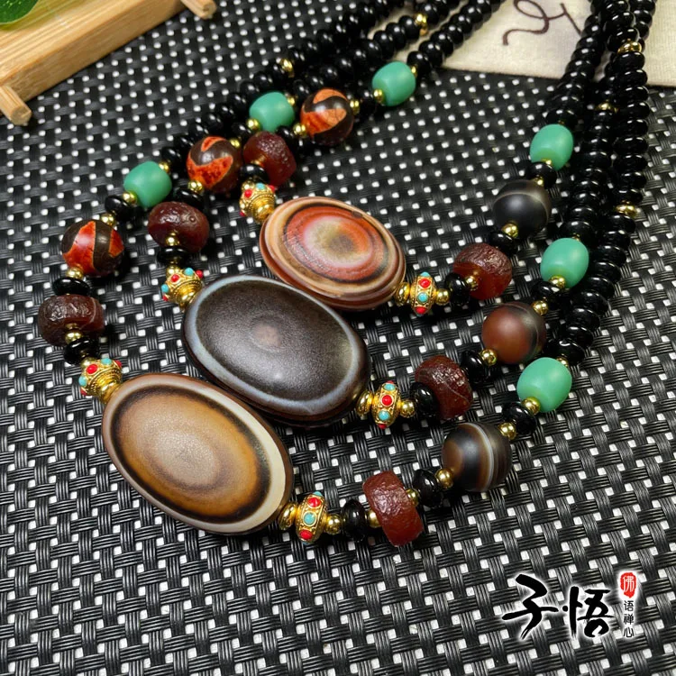 

Tibetan-style old agate sheep eye Dzi Bead clavicle Chain Fashion for men and women Silk-wrapped agate sheep eye Bead Necklace