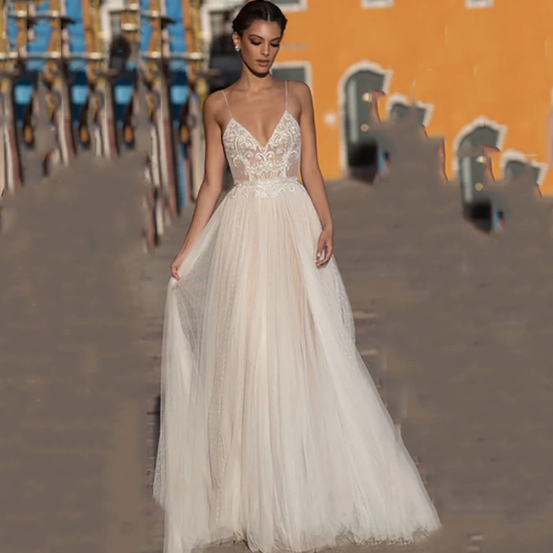 

Backless Wedding Dresses A-line Spaghetti Straps Tulle Appliques Boho Dubai Arabic Wedding Gown Bridal Dress Vestido De Noiva