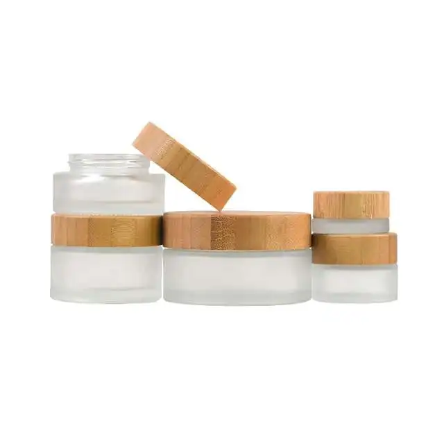 

Wholesale Customized Eye Shadow Lip Gloss Panckaging Jar With Bamboo Lid For Skin Care Eye Cream CBD Hemp Cream Glass Containers