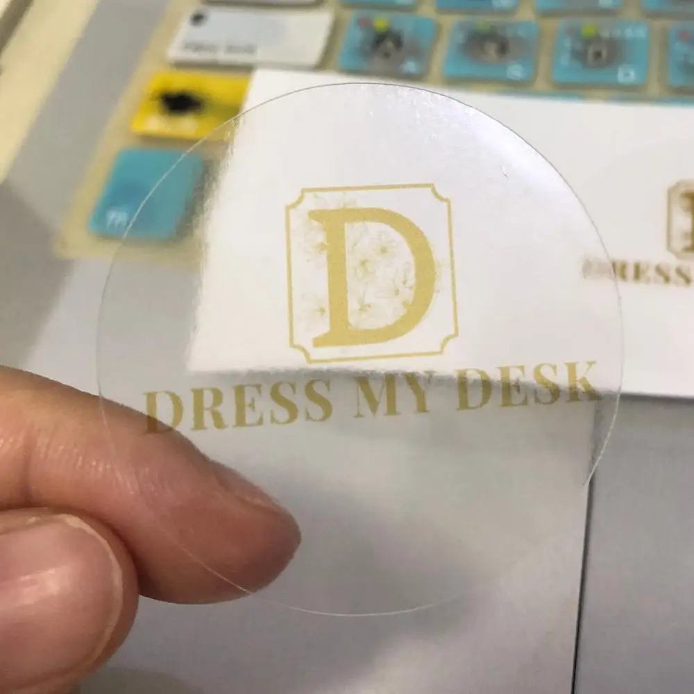 

4.5cm clear transparent sticker with your customized logos in gold print