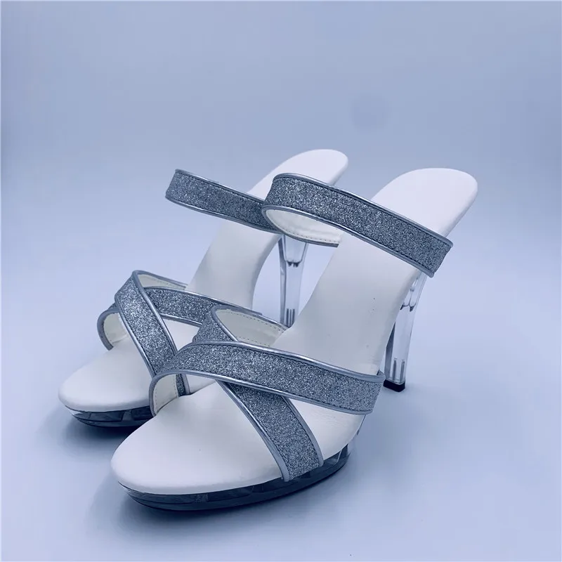 Models walk the stage in sexy silver sequined heels and nightclub chic 13cm high-heeled sandals