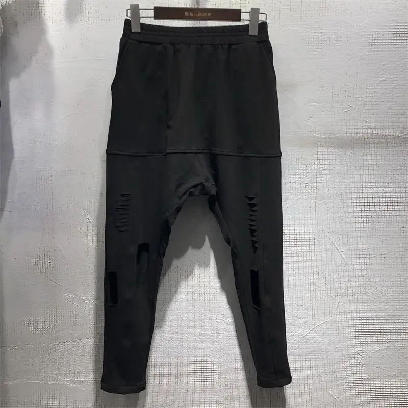 Men's new summer personality, irregular holes, harlan pants fashion trend, slim and versatile black cropped pants