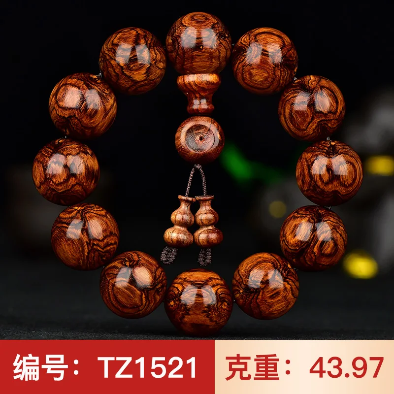 

Dalbergia odorifera spider pattern on ghost eye 20mm Hainan Huanghua pear hand string male Buddha beads old material Stationery