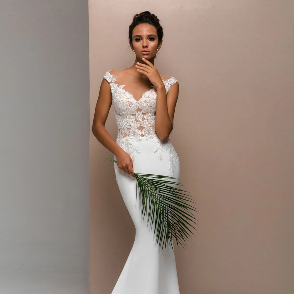 Abito da sposa senza schienale a sirena maniche ad aletta scollo a V applicazioni economici trasparenti Sweep Train Beach abiti da sposa Robe personalizzato